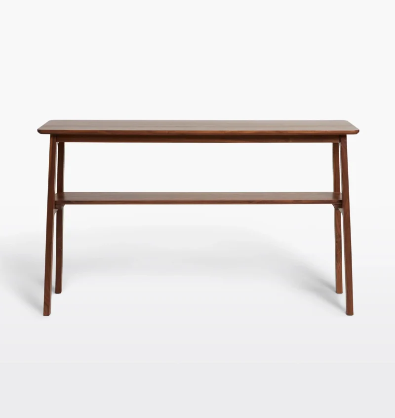 Mid century console table featuring open design, tapered legs, and dual shelves for storage.