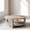Round Wooden Coffee Table with natural finish and lower shelf design.