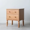 Classic Nightstand with two drawers and sculpted legs in a modern bedroom setting