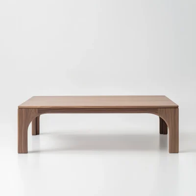 Arched leg coffee table styled in soft living room setting with sculptural presence and clean layout